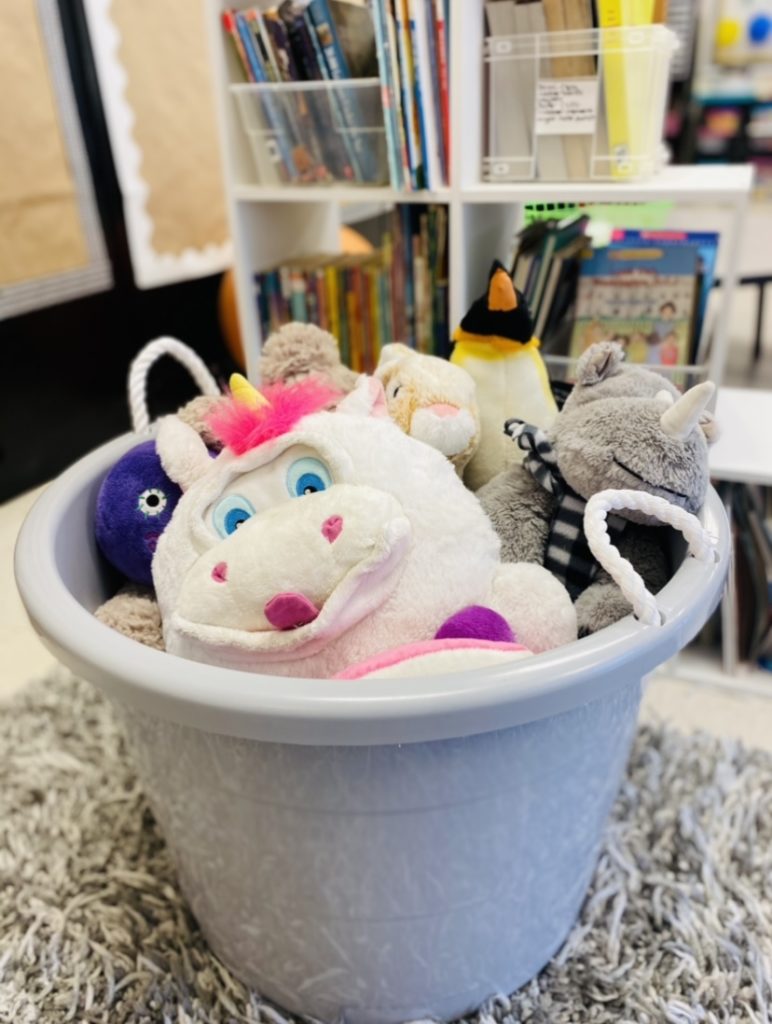 bucket full of stuffed animals for reading buddies